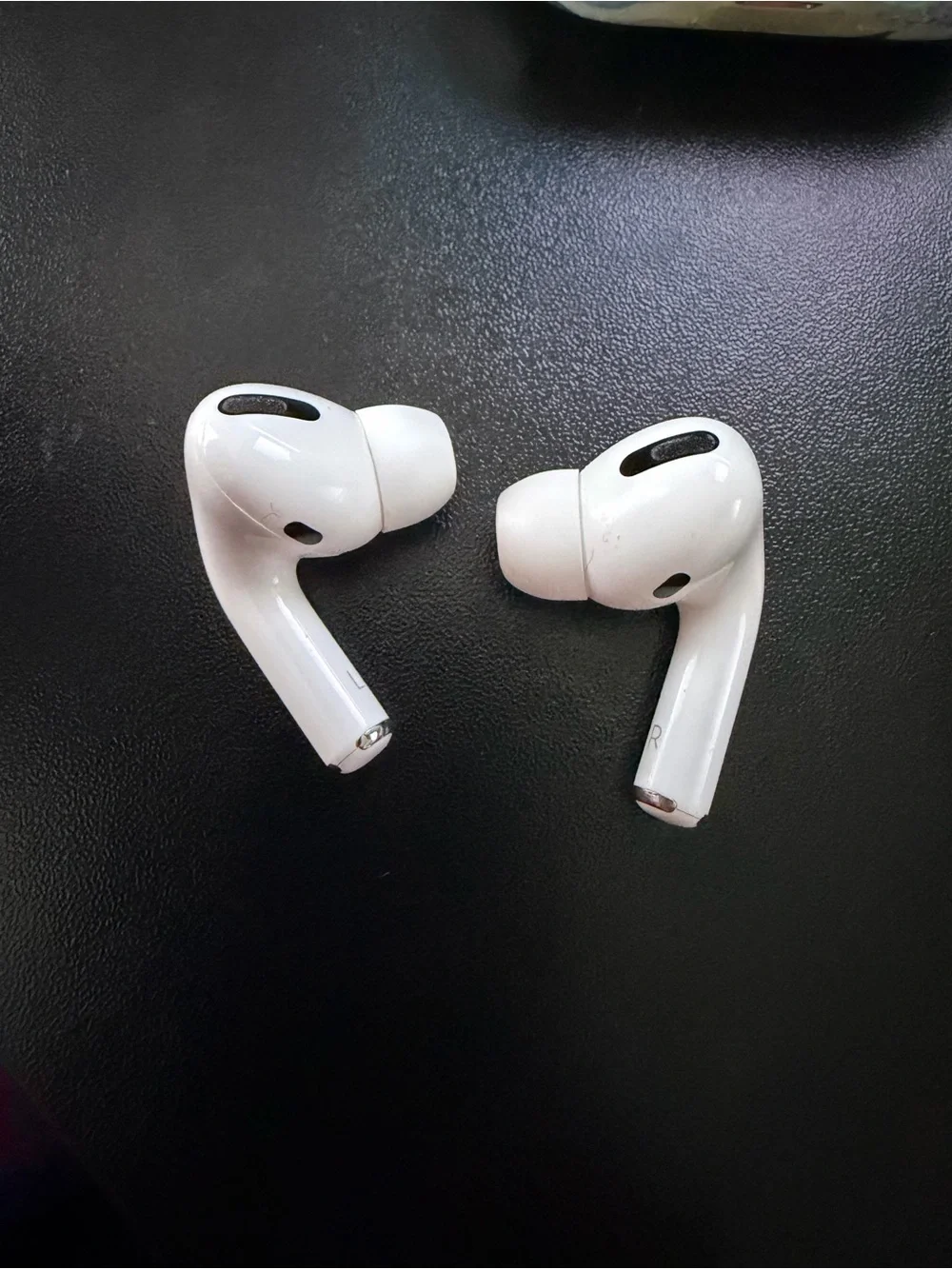 1st generation Apple AirPods Pro with rifle paper company case